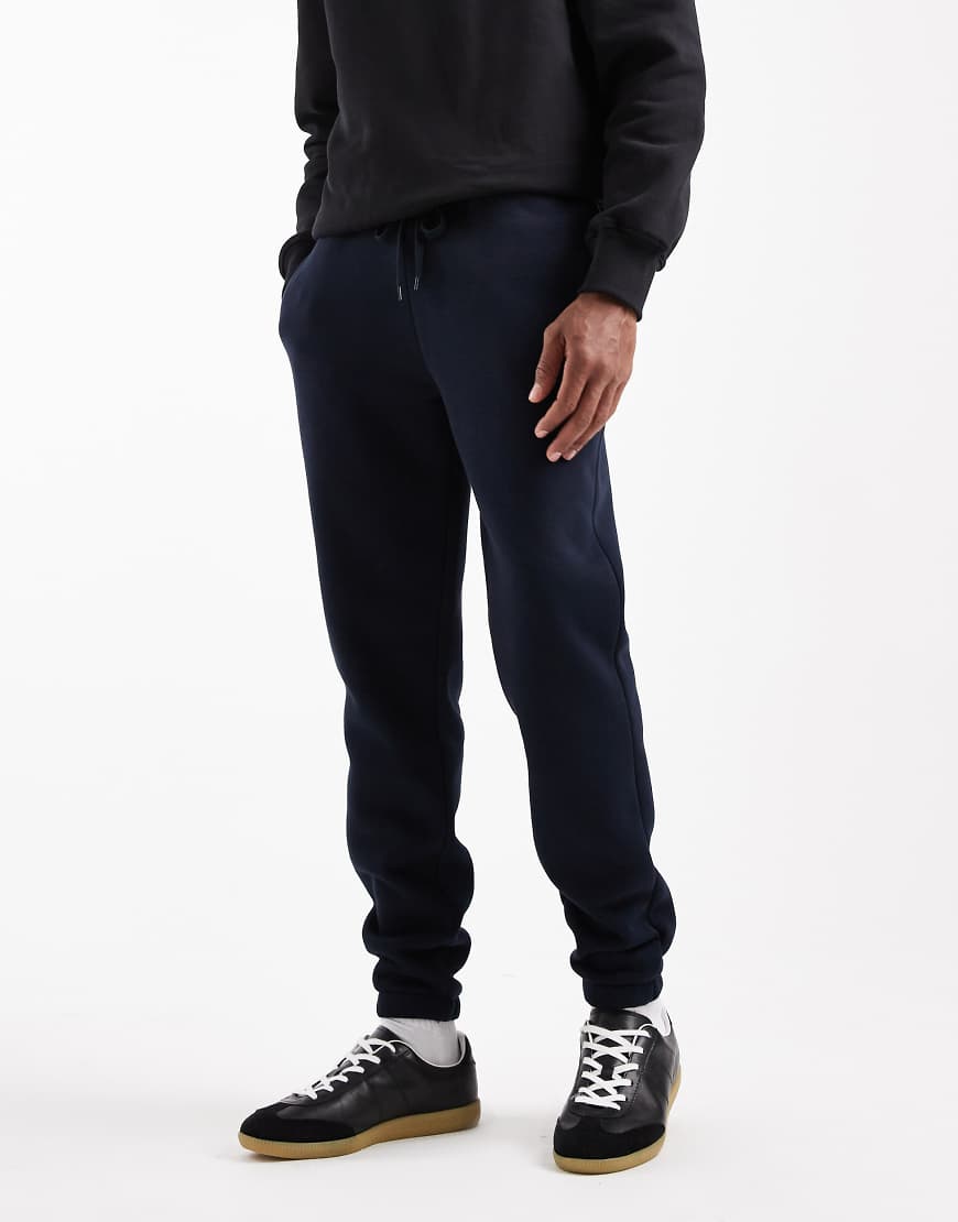ASOS DESIGN - Basic-Jogginghose in Marineblau mit Slim-Fit-Passform von ASOS DESIGN