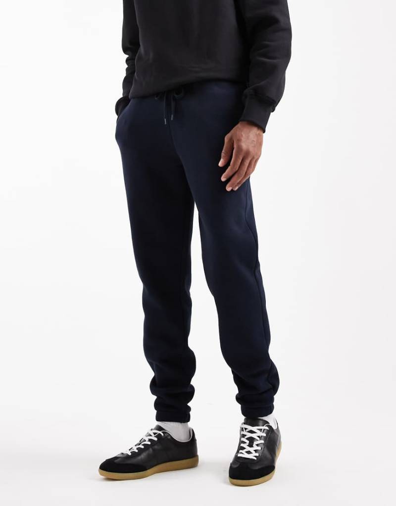 ASOS DESIGN - Schmal geschnittene Basic-Jogginghose in Marineblau von ASOS DESIGN