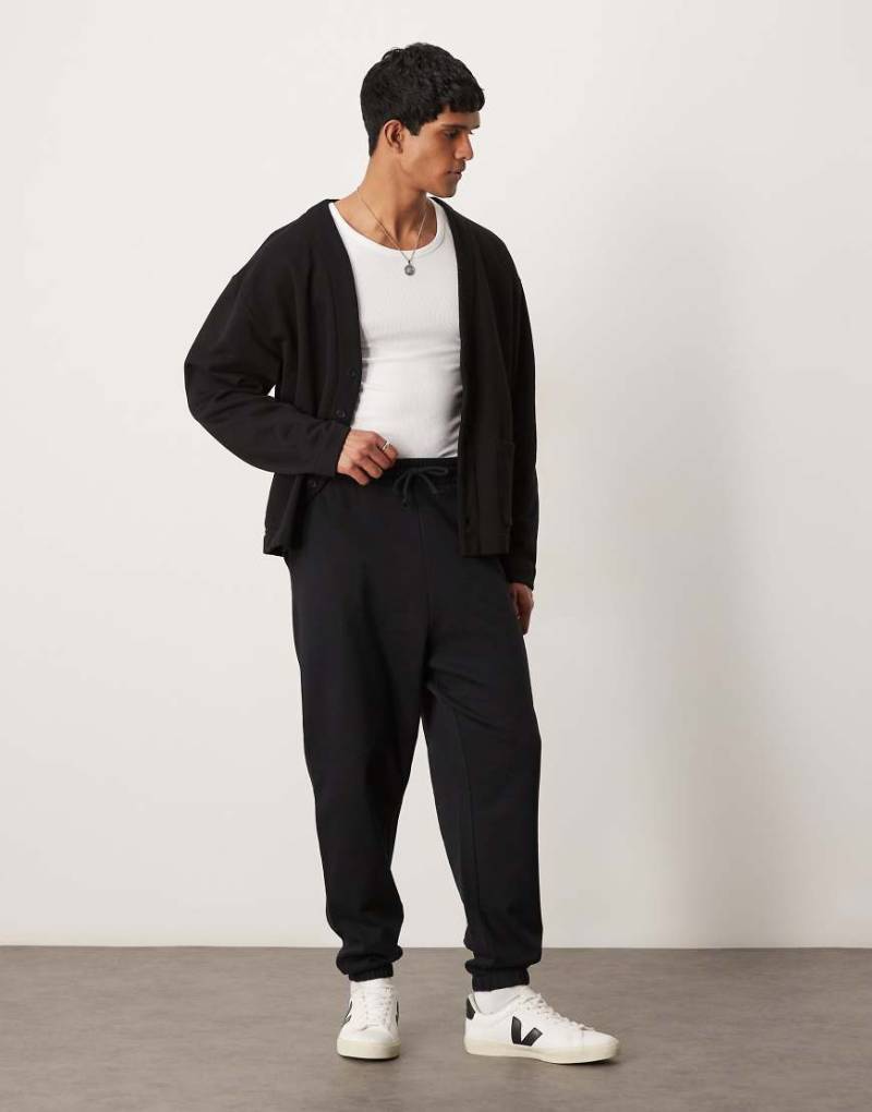 ASOS DESIGN - Basic-Jogginghose in meliertem Grau mit Oversize-Schnitt von ASOS DESIGN