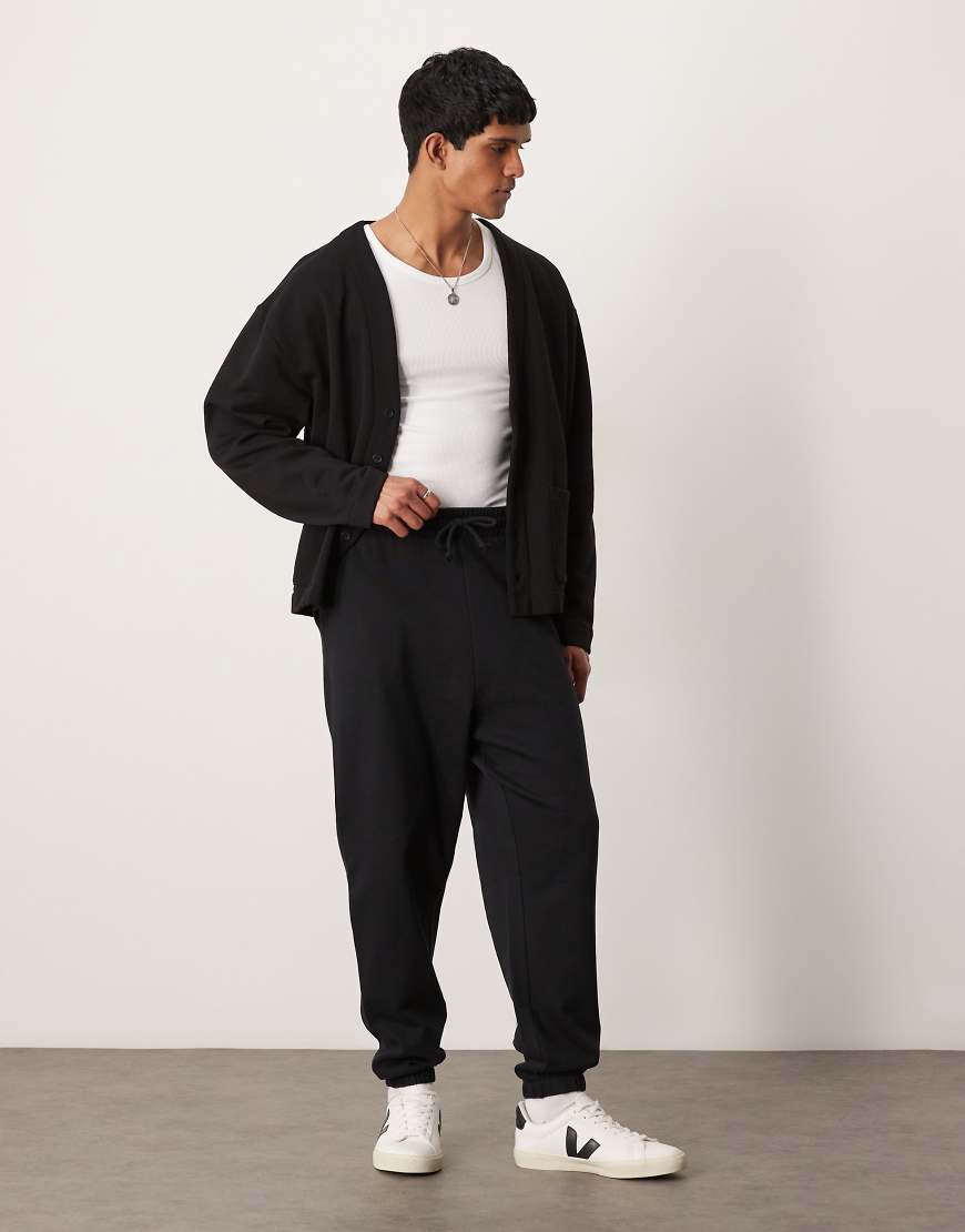 ASOS DESIGN - Basic-Jogginghose in meliertem Grau mit Oversize-Schnitt von ASOS DESIGN