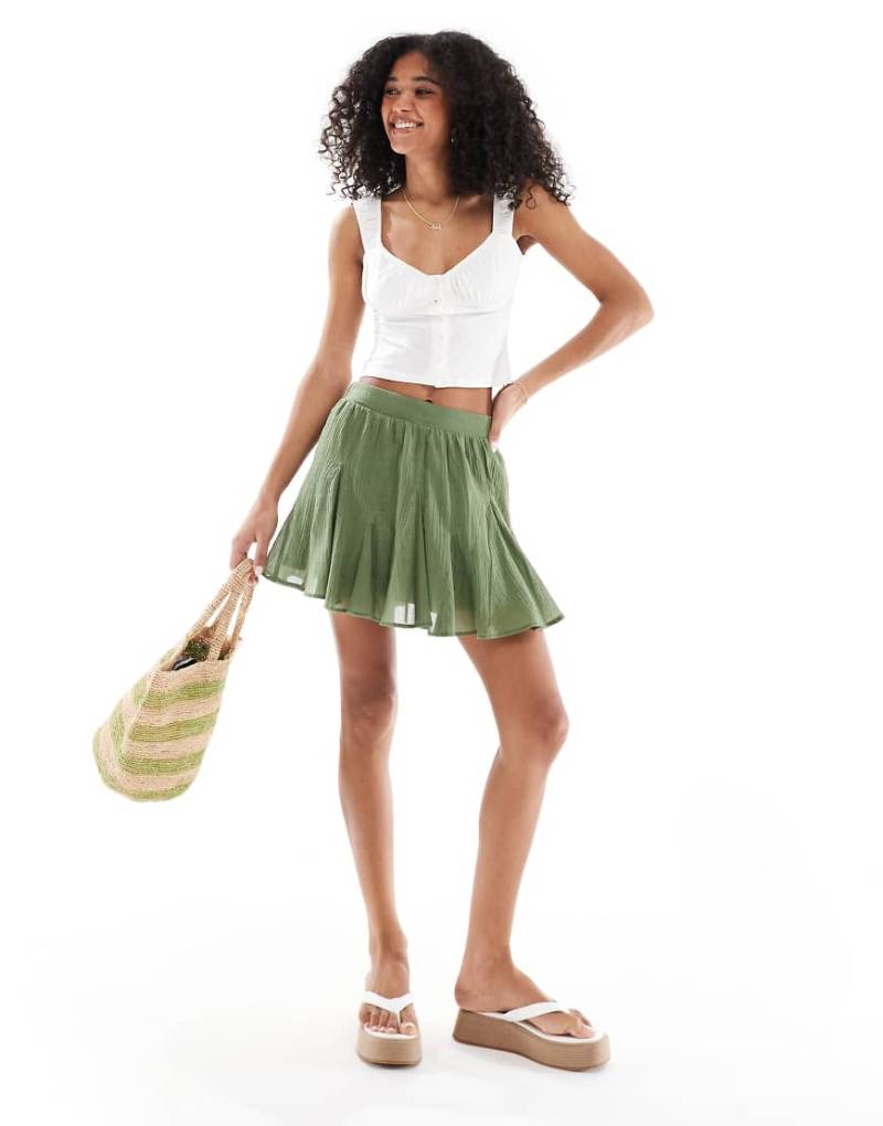 ASOS DESIGN - Baumwoll-Minirock in Khaki mit Godet-Detail-Grün von ASOS DESIGN