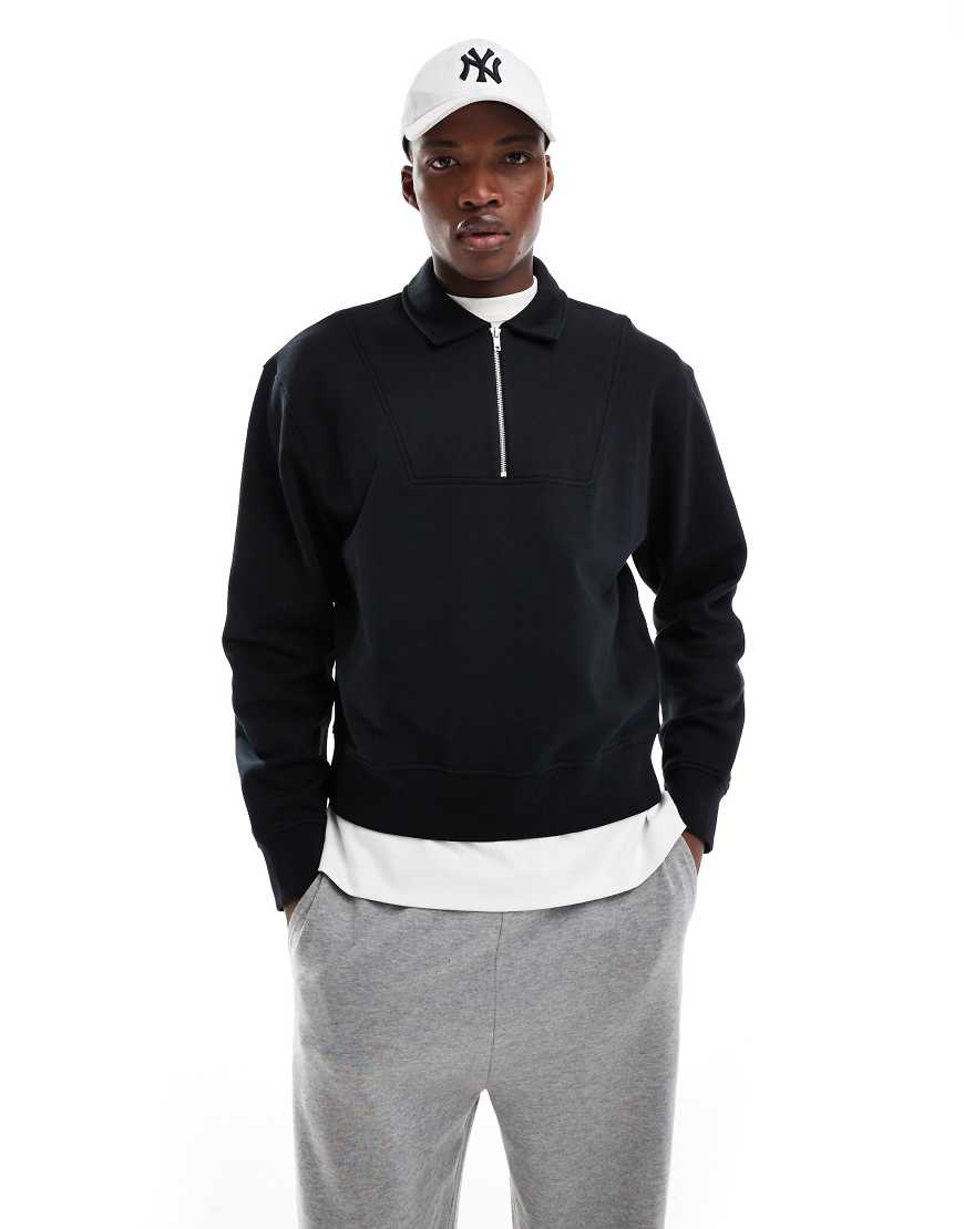ASOS DESIGN - Boxy Fit Oversize-Sweatshirt in Schwarz mit kurzem Reißverschluss von ASOS DESIGN