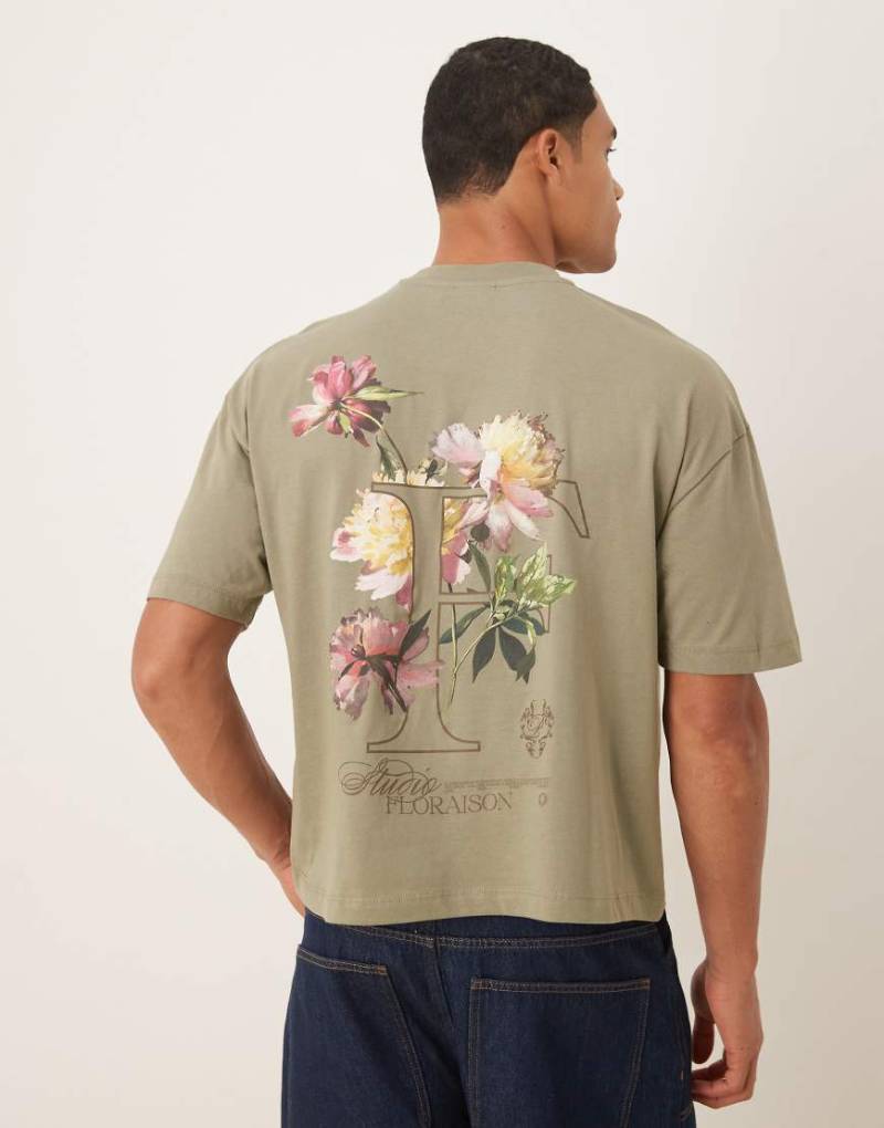 ASOS DESIGN - Boxy Fit Oversize-T-Shirt in hellem Khaki mit Blumen- und Textprint-Grün von ASOS DESIGN