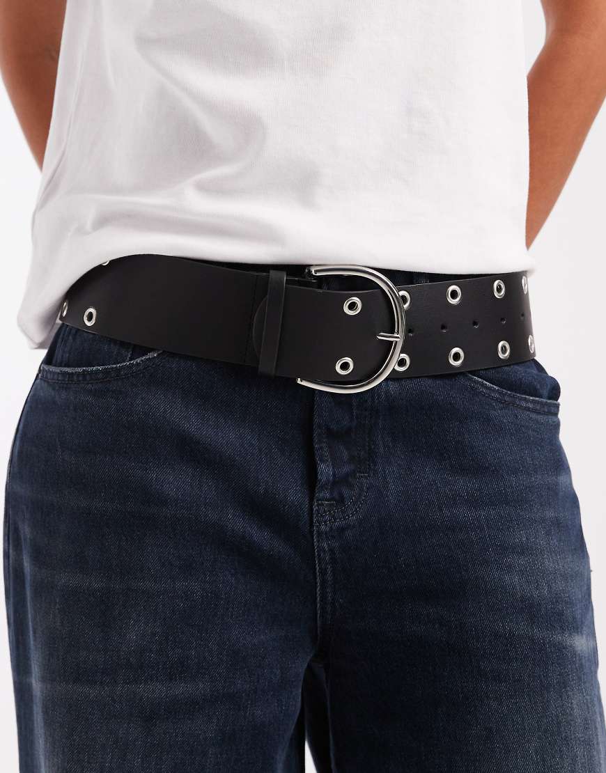 ASOS DESIGN - Breiter Gürtel für tiefsitzenden Taillenbund in Schwarz mit Ösen-Verzierungen von ASOS DESIGN