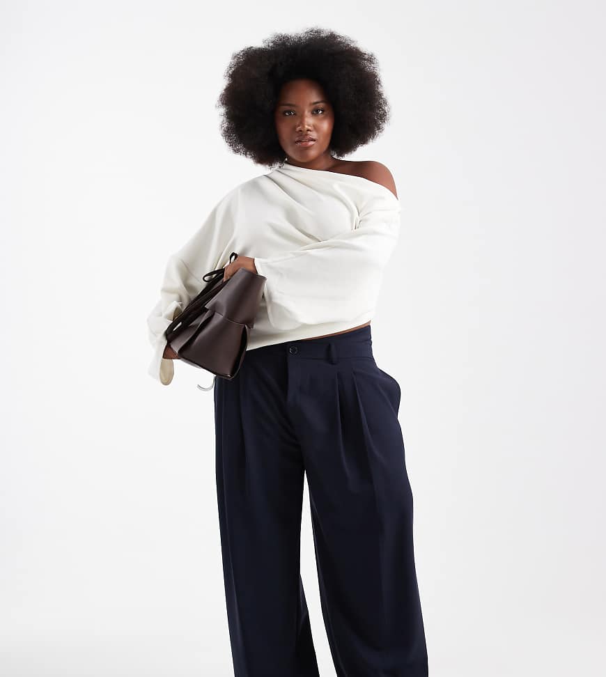 ASOS DESIGN Curve - Elegante Hose in Marineblau mit niedrigem, asymmetrischem Bund und weitem Bein von ASOS DESIGN