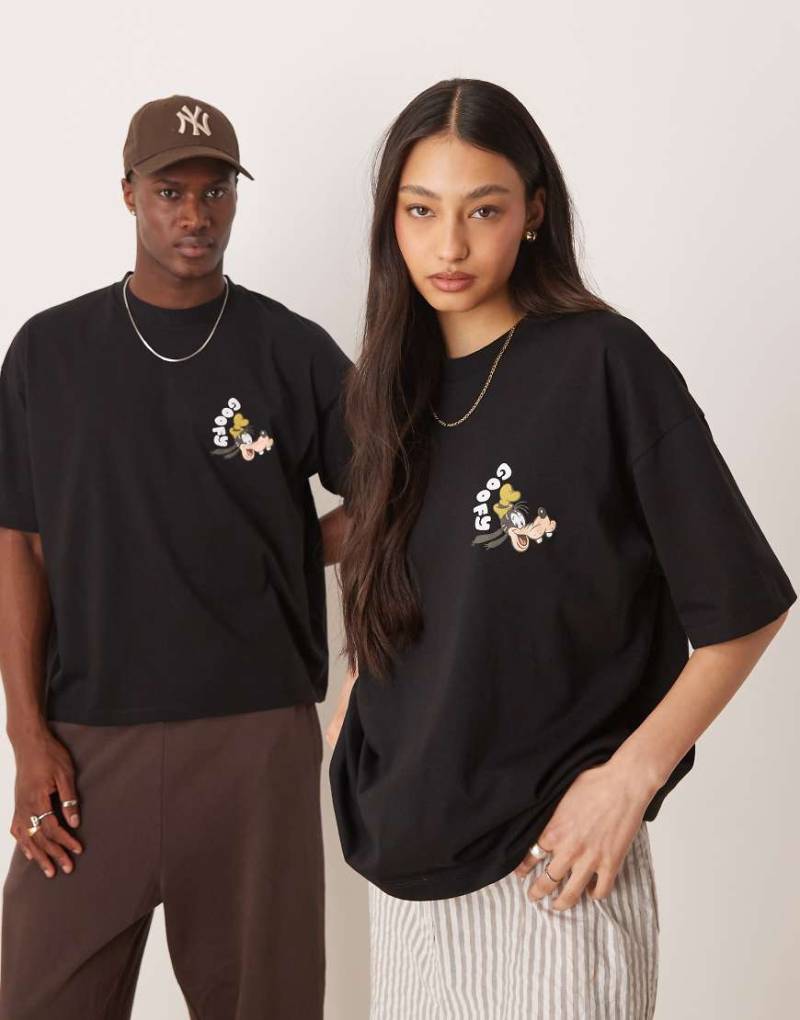 ASOS DESIGN - Disney - Unisex - Kastiges Oversize-T-Shirt in Schwarz mit Goofy-Prints von ASOS DESIGN