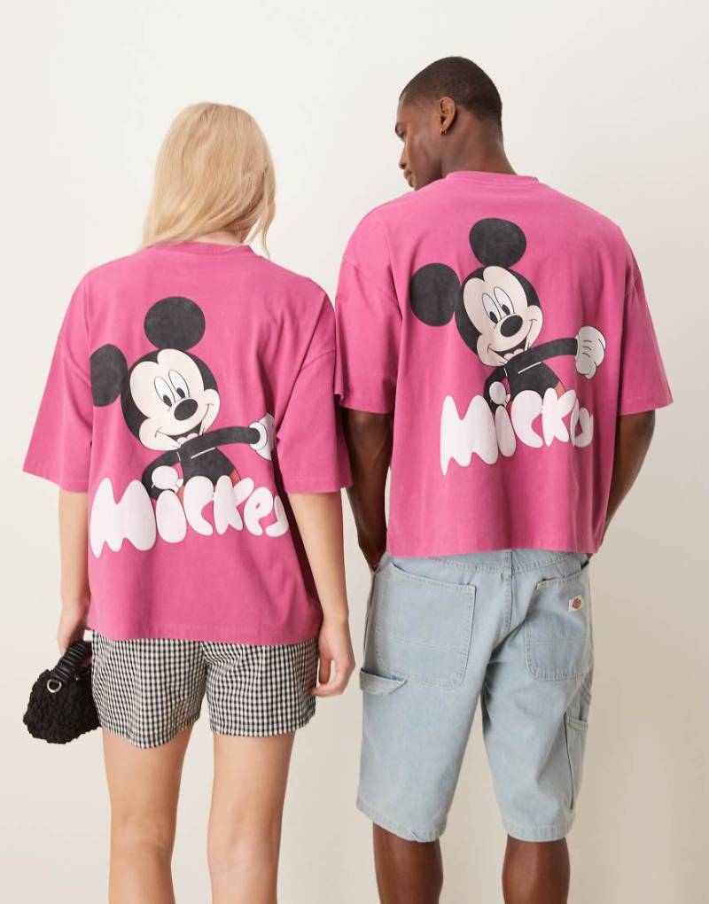 ASOS DESIGN - Disney - Unisex-T-Shirt in verwaschenem Rosa mit „Mickey"-Prints und kastigem Oversize-Schnitt von ASOS DESIGN