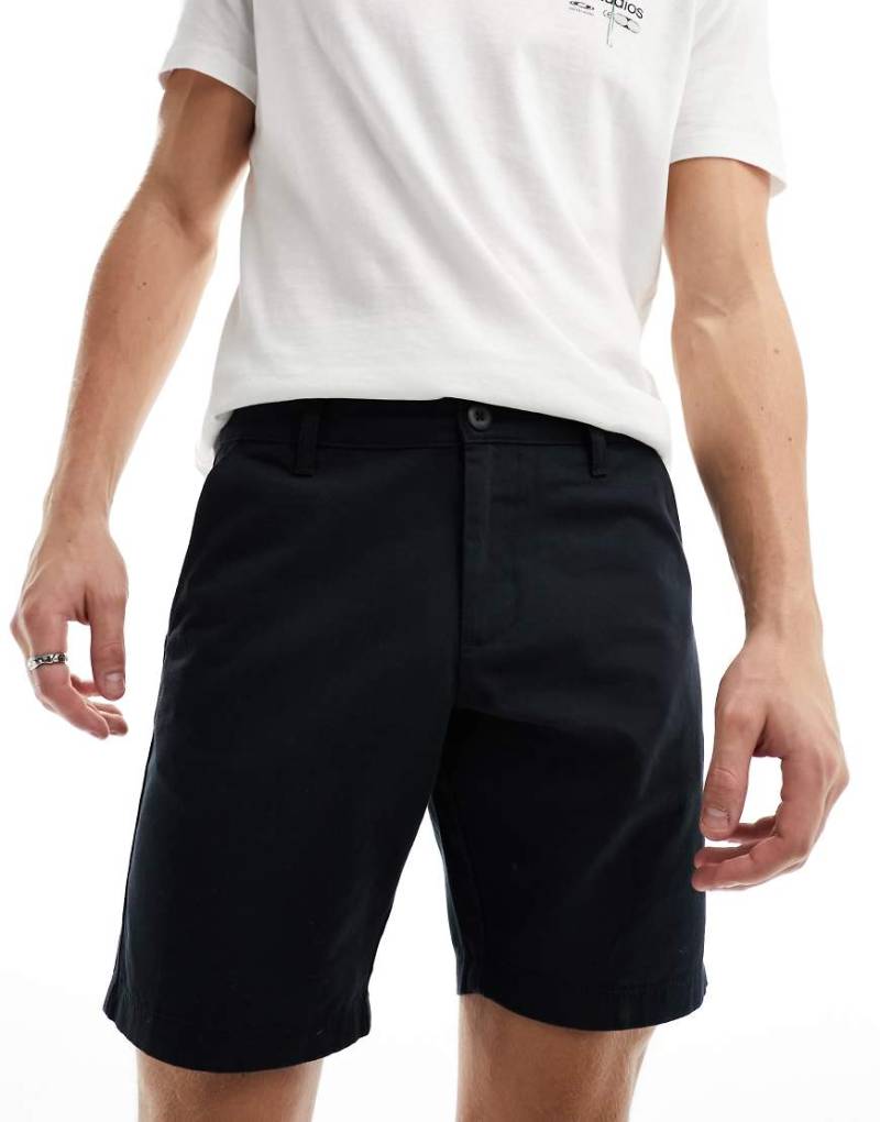 ASOS DESIGN - Elastische Chino-Shorts in Schwarz mit schmalem Schnitt von ASOS DESIGN