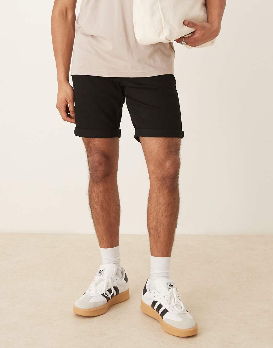ASOS DESIGN - Elastische Jeans-Shorts in Schwarz in normaler Länge mit schmalem Schnitt ASOS DESIGN - Elastische Jeans-Shorts in Schwarz in normaler Länge mit schmalem Schnitt von ASOS DESIGN