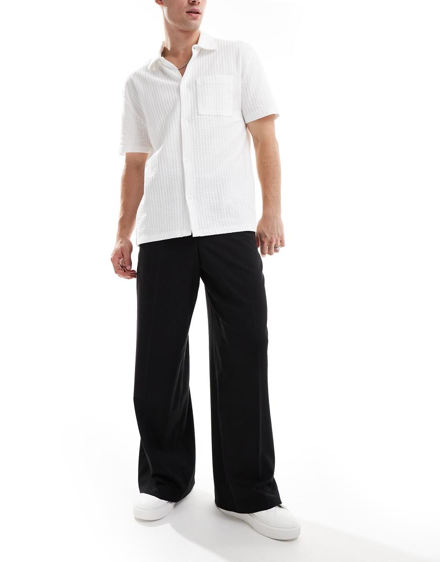 ASOS DESIGN - Elegante, locker sitzende Hose in Schwarz-Weiß ASOS DESIGN - Elegante, locker sitzende Hose in Schwarz-Weiß von ASOS DESIGN