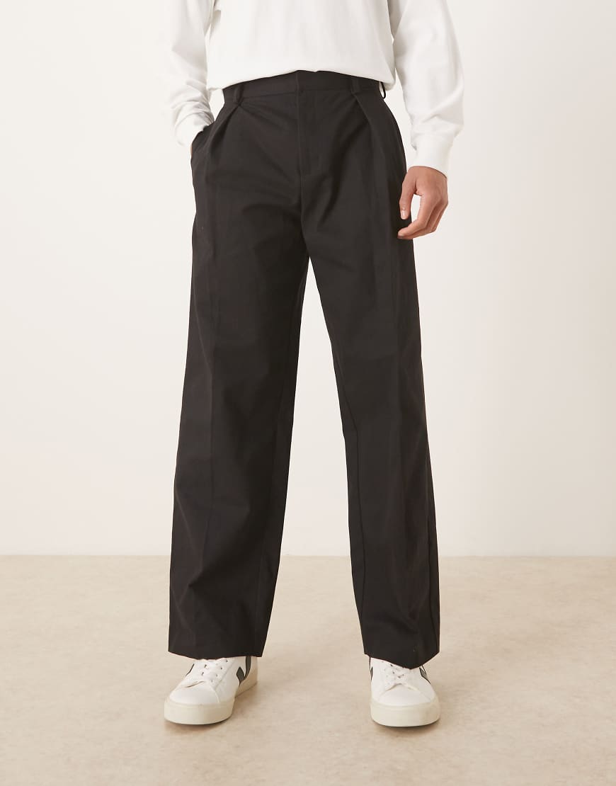 ASOS DESIGN - Elegante Hose aus 100% Baumwolle in Schwarz mit weitem Bein und tiefen Bundfalten von ASOS DESIGN