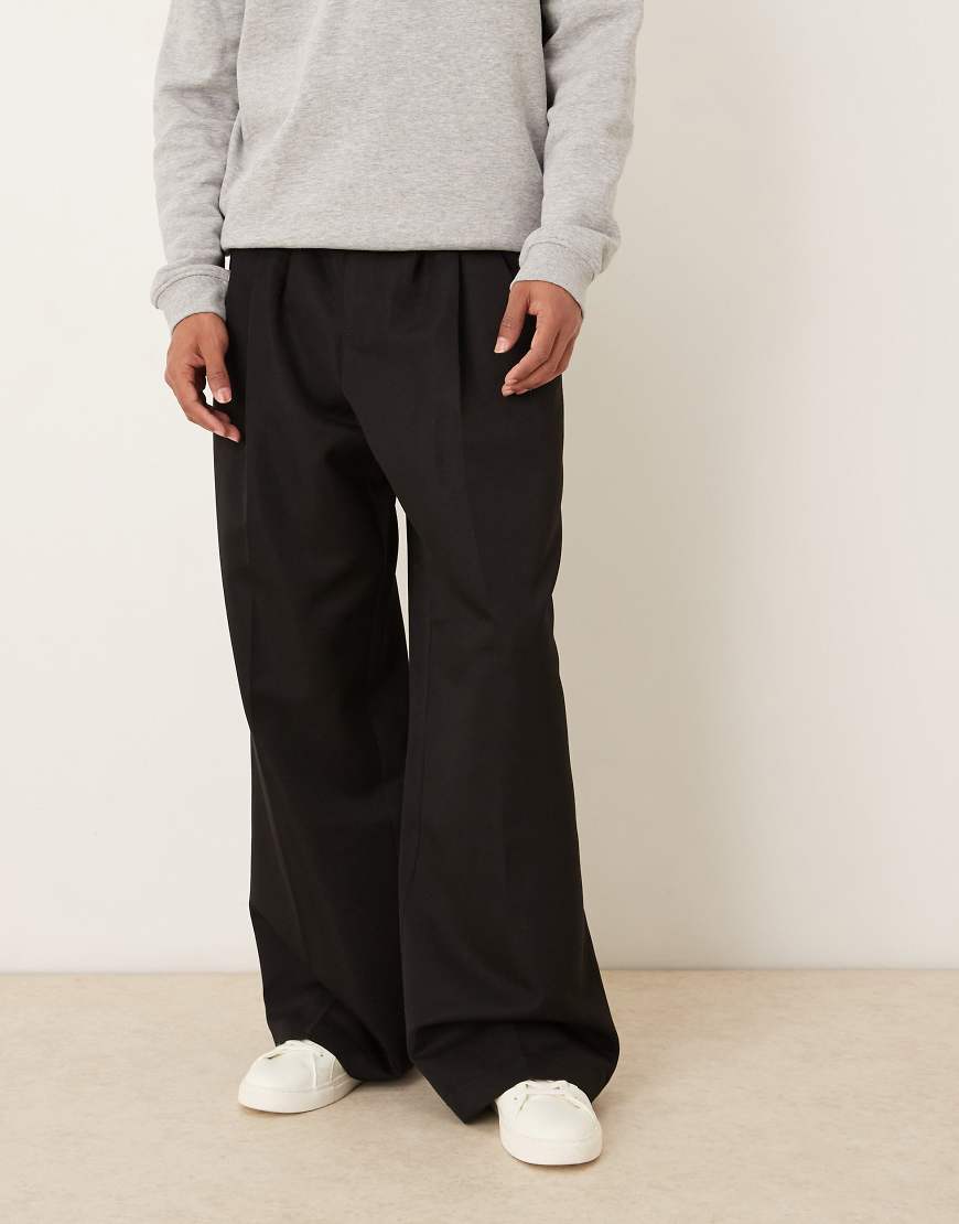 ASOS DESIGN - Elegante Hose in Schwarz mit lockerem Bein und drei Bundfalten von ASOS DESIGN