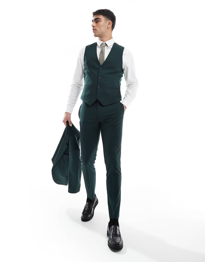 ASOS DESIGN - Eng geschnittene Anzugweste in Dunkelgrün ASOS DESIGN - Eng geschnittene Anzugweste in Dunkelgrün von ASOS DESIGN