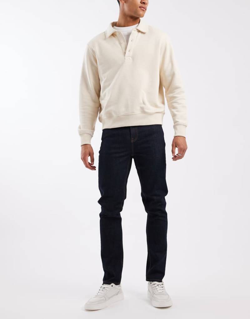 ASOS DESIGN - Enge Jeans in indigoblauer Raw-Waschung von ASOS DESIGN