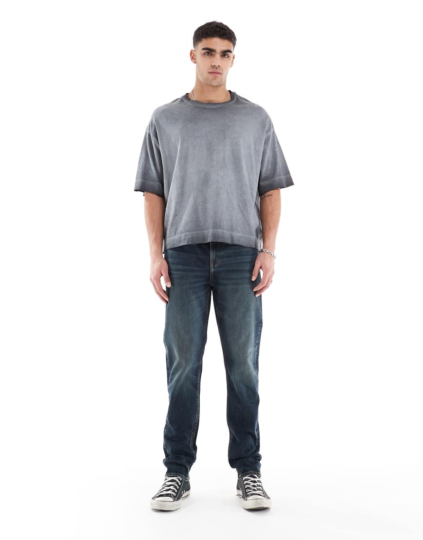 ASOS DESIGN - Enge Jeans in verwaschenem Mittelblau ASOS DESIGN - Enge Jeans in verwaschenem Mittelblau von ASOS DESIGN