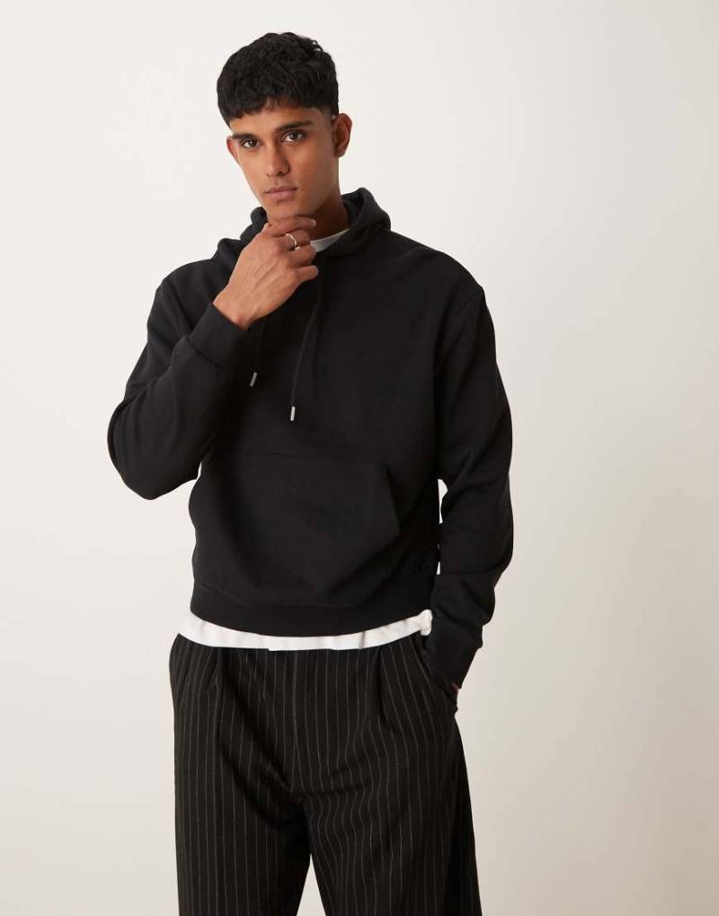 ASOS DESIGN - Essential - Kastiger Oversize-Kapuzenpullover in Schwarz von ASOS DESIGN
