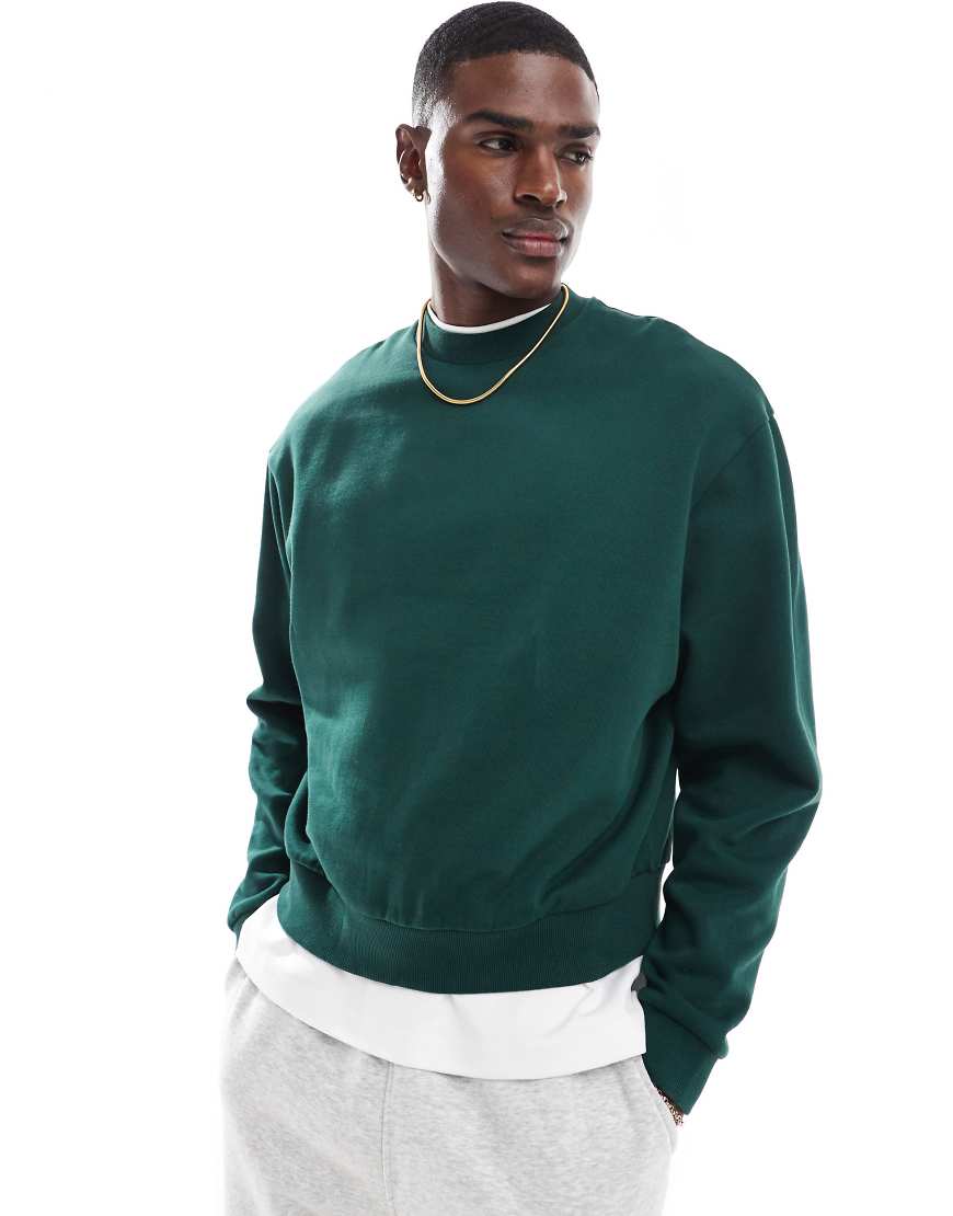 ASOS DESIGN - Essential - Kastiges Oversize-Sweatshirt in Dunkelgrün ASOS DESIGN - Essential - Kastiges Oversize-Sweatshirt in Dunkelgrün von ASOS DESIGN