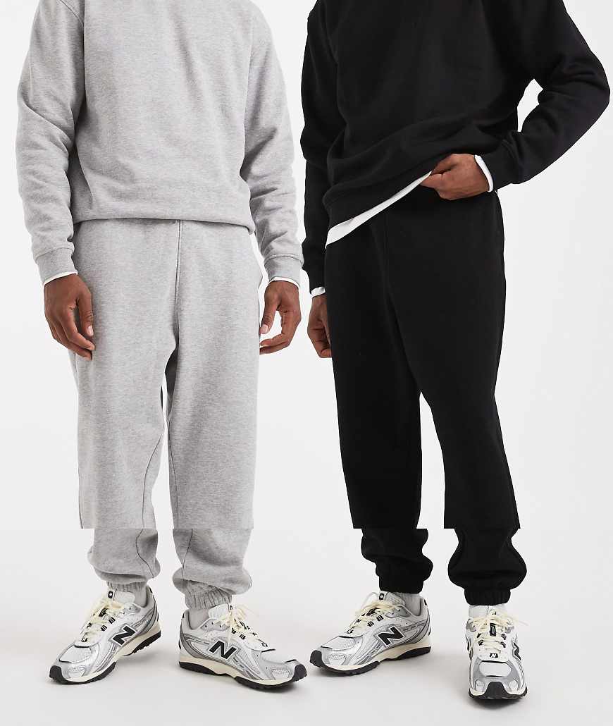 ASOS DESIGN - Essentials - 2er-Pack Oversize-Jogginghosen in Schwarz und meliertem Grau-Bunt von ASOS DESIGN