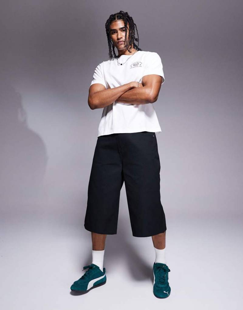 ASOS DESIGN - Länger geschnittene Shorts in Schwarz von ASOS DESIGN