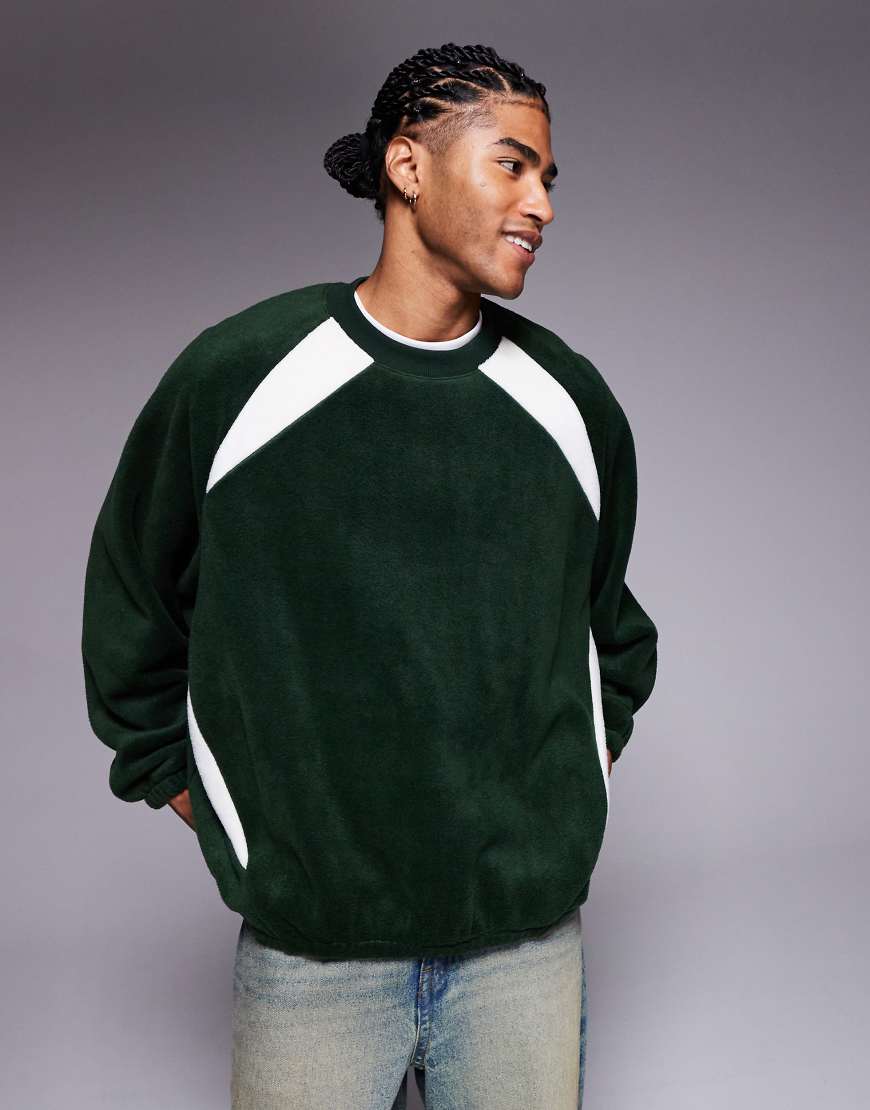 ASOS DESIGN - Extremes Oversize-Fleece-Sweatshirt mit Raglanärmeln in Dunkelgrün von ASOS DESIGN
