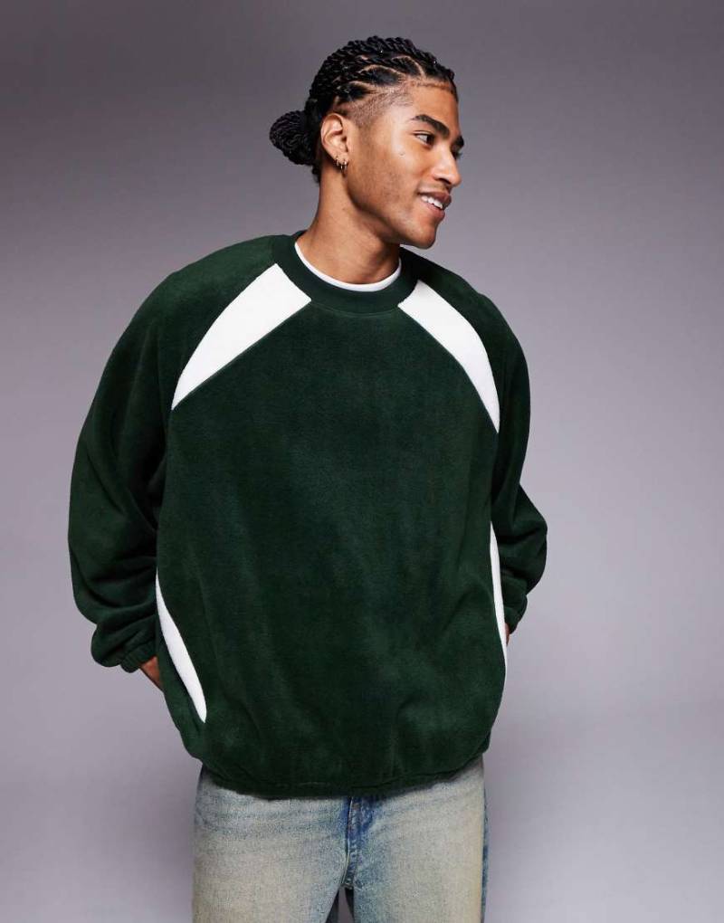 ASOS DESIGN - Extremes Oversize-Fleece-Sweatshirt mit Raglanärmeln in Dunkelgrün von ASOS DESIGN