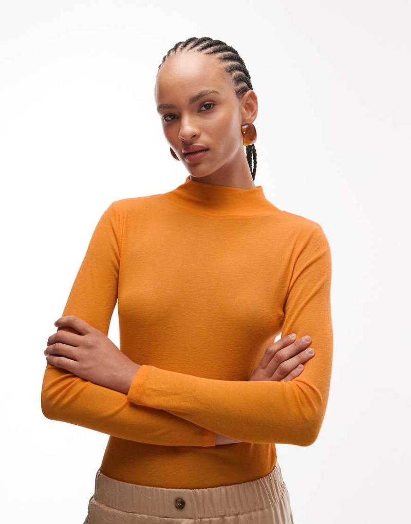 ASOS DESIGN - Figurbetontes Polohemd in Orange mit langen Ärmeln von ASOS DESIGN