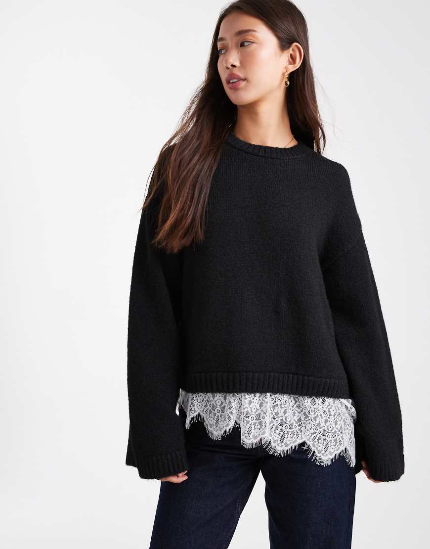 ASOS DESIGN - Flauschiger Strickpullover in Schwarz mit weiten Ärmeln und Spitzensaum von ASOS DESIGN