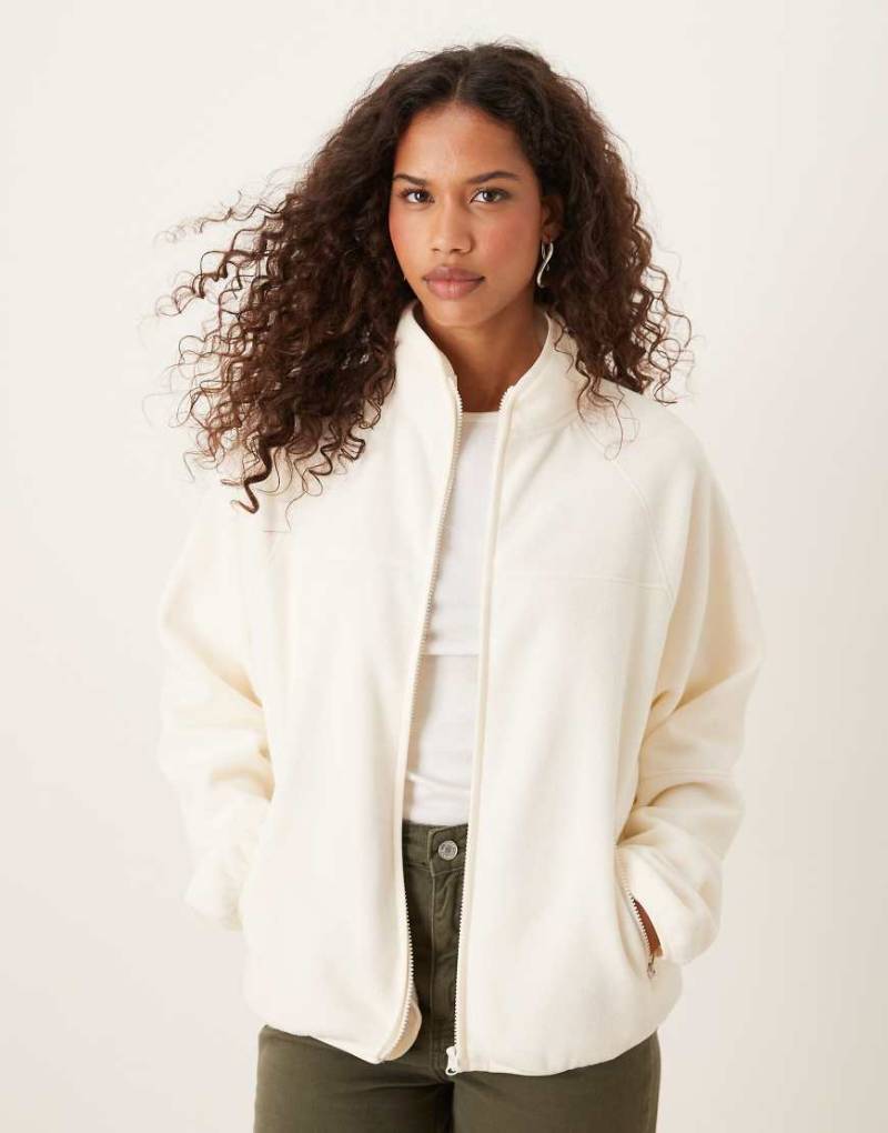 ASOS DESIGN - Fleece-Sweatshirt in Cremeweiß mit durchgehendem Reißverschluss von ASOS DESIGN