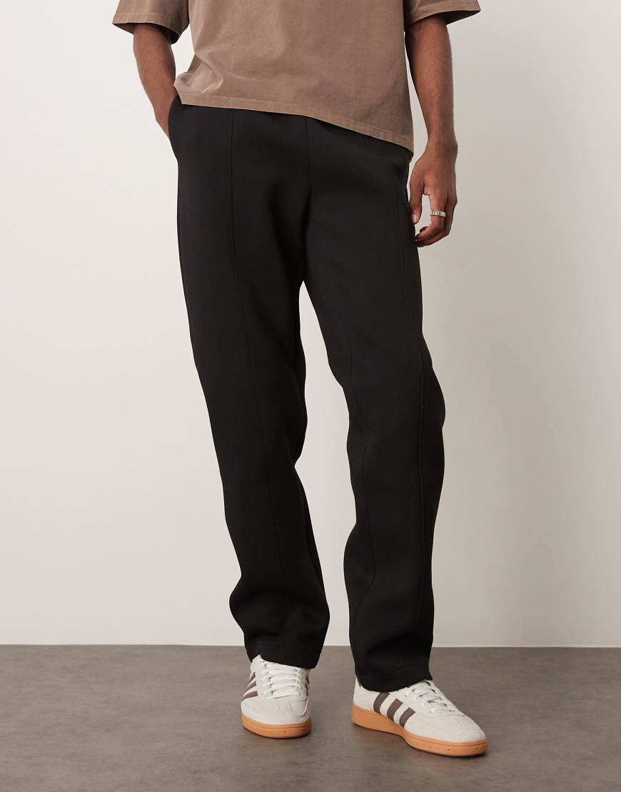 ASOS DESIGN - Gerade geschnittene Jogginghose aus schwerem, neoprenartigem Stoff in Schwarz mit Biesen von ASOS DESIGN
