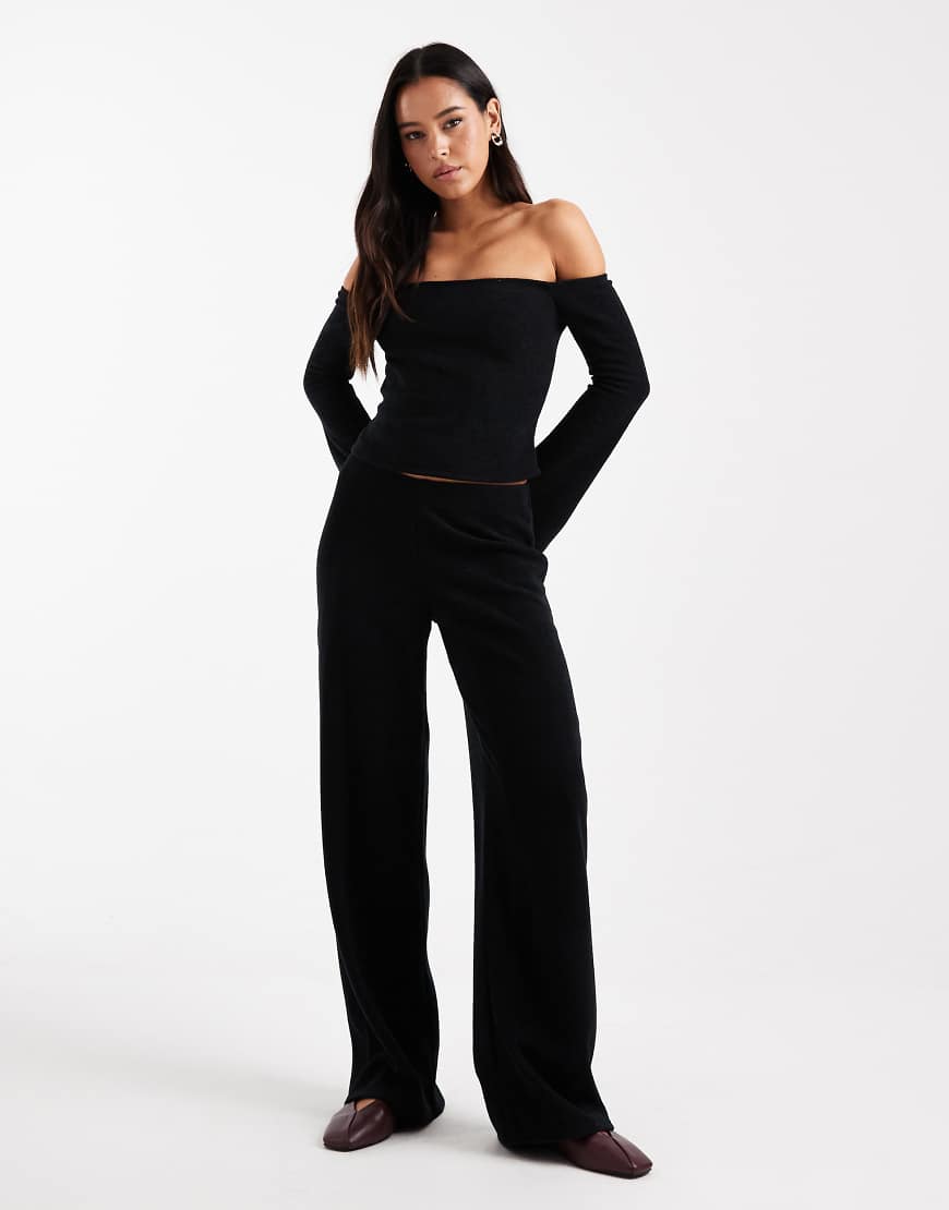 ASOS DESIGN - Gerippte, angeraute Hose in Schwarz mit weitem Bein, Kombiteil von ASOS DESIGN