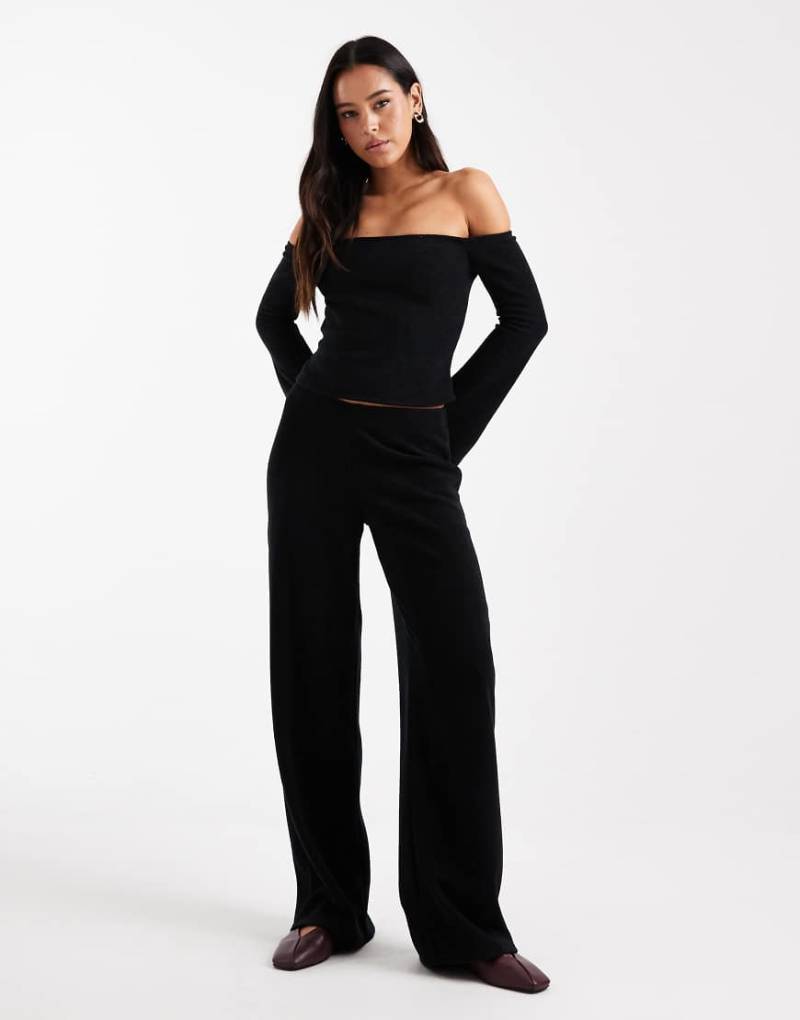 ASOS DESIGN - Gerippte, angeraute Hose in Schwarz mit weitem Bein, Kombiteil von ASOS DESIGN