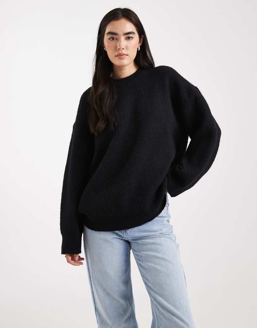 ASOS DESIGN - Gerippter Oversize-Pullover in Schwarz mit Rundhalsausschnitt und Cocoon-Ärmeln von ASOS DESIGN
