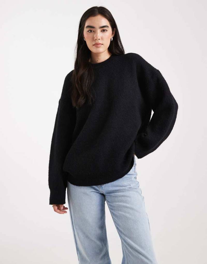 ASOS DESIGN - Gerippter Oversize-Pullover in Schwarz mit Rundhalsausschnitt und Cocoon-Ärmeln von ASOS DESIGN