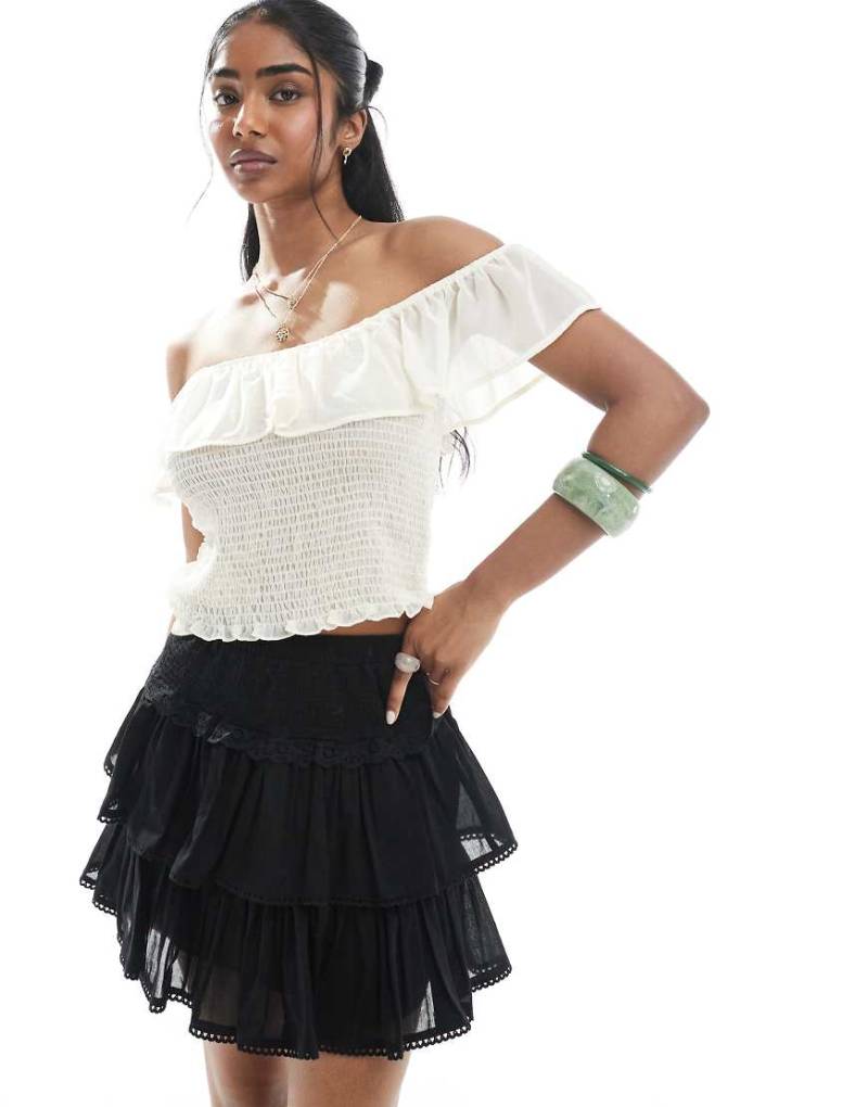 ASOS DESIGN - Gerüschter Minirock in Schwarz mit Spitzenbesatz von ASOS DESIGN