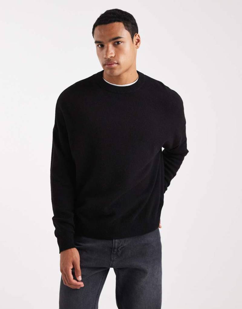 ASOS DESIGN - Gestrickter Oversize-Pullover aus Lammwolle in Schwarz mit Rundhalsausschnitt von ASOS DESIGN