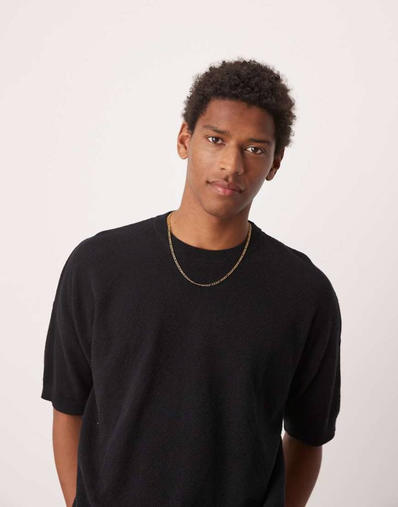 ASOS DESIGN - Gestricktes Oversize-T-Shirt in Schwarz mit Pikee-Struktur von ASOS DESIGN