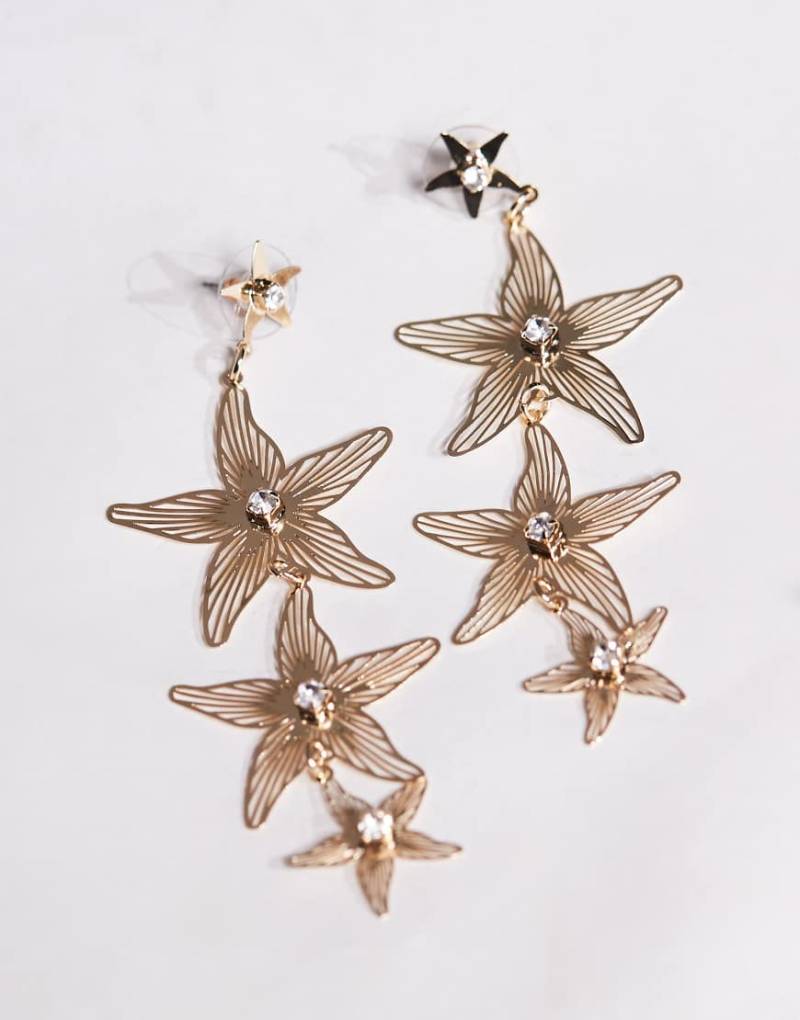 ASOS DESIGN - Goldfarbene Hängeohrringe im Seestern-Design mit Schmucksteinen von ASOS DESIGN