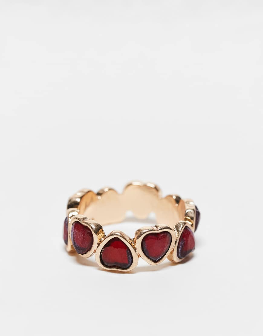 ASOS DESIGN - Goldfarbener Ring mit rubinrotem Kristall-Detail von ASOS DESIGN