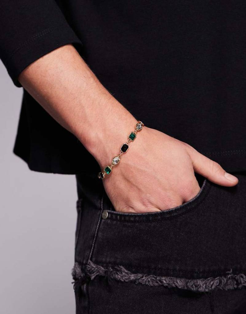 ASOS DESIGN - Goldfarbenes Armband mit Schmucksteinen in Smaragdgrün und Schwarz und Kristallen von ASOS DESIGN