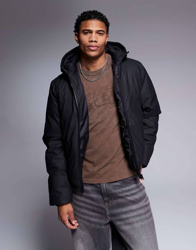 ASOS DESIGN - Gummierte Steppjacke in Schwarz von ASOS DESIGN