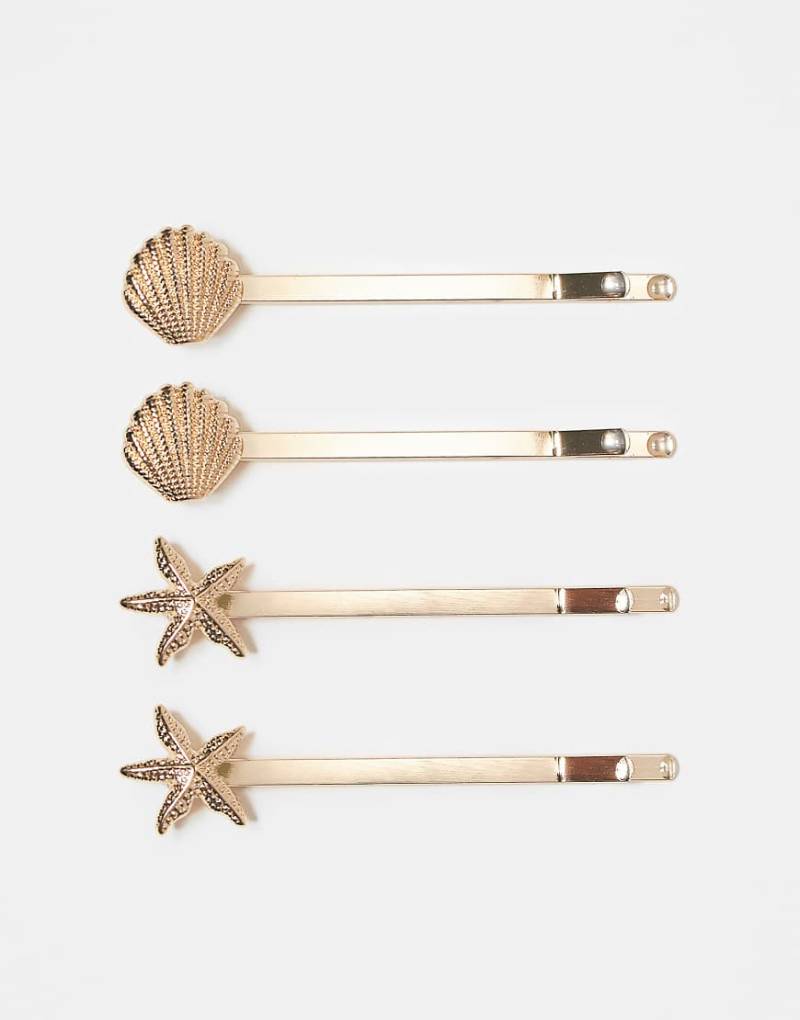 ASOS DESIGN - Haarklammern im 4er-Pack mit Muschel- und Seesterndetail-Goldfarben von ASOS DESIGN