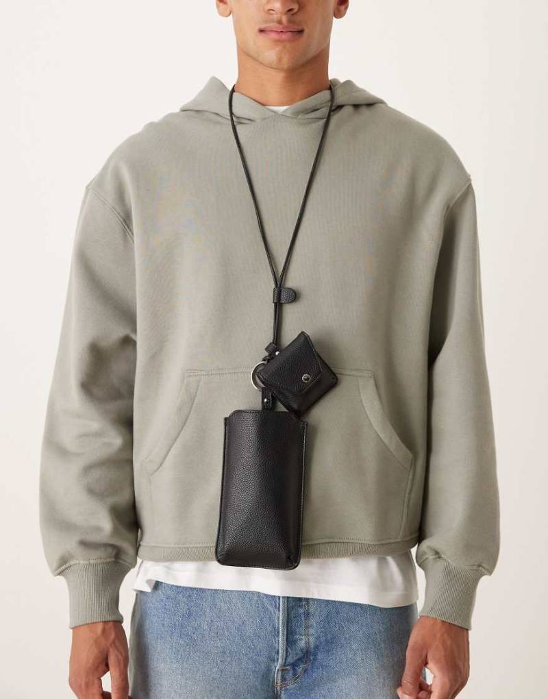 ASOS DESIGN - Handytasche in Schwarz mit Umhängeriemen von ASOS DESIGN