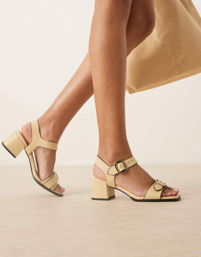 ASOS DESIGN - Harland - Schuhe aus hochwertigem Leder in Buttermilchgelb mit mittelhohem Absatz und Schnallendetail von ASOS DESIGN