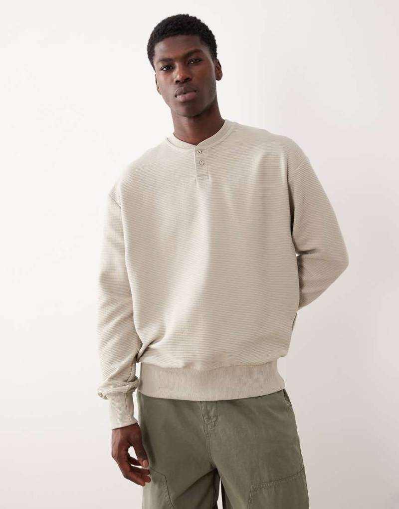 ASOS DESIGN - Henley-Sweatshirt in Steinbeige mit lockerem Schnitt und Rippenstruktur-Neutral von ASOS DESIGN