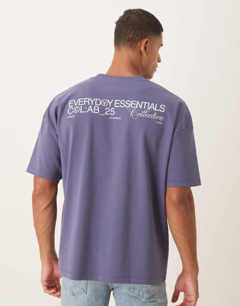 ASOS DESIGN - Oversize-T-Shirt aus superschwerem Stoff in Blau mit überschnittener Schulter und Textprint von ASOS DESIGN