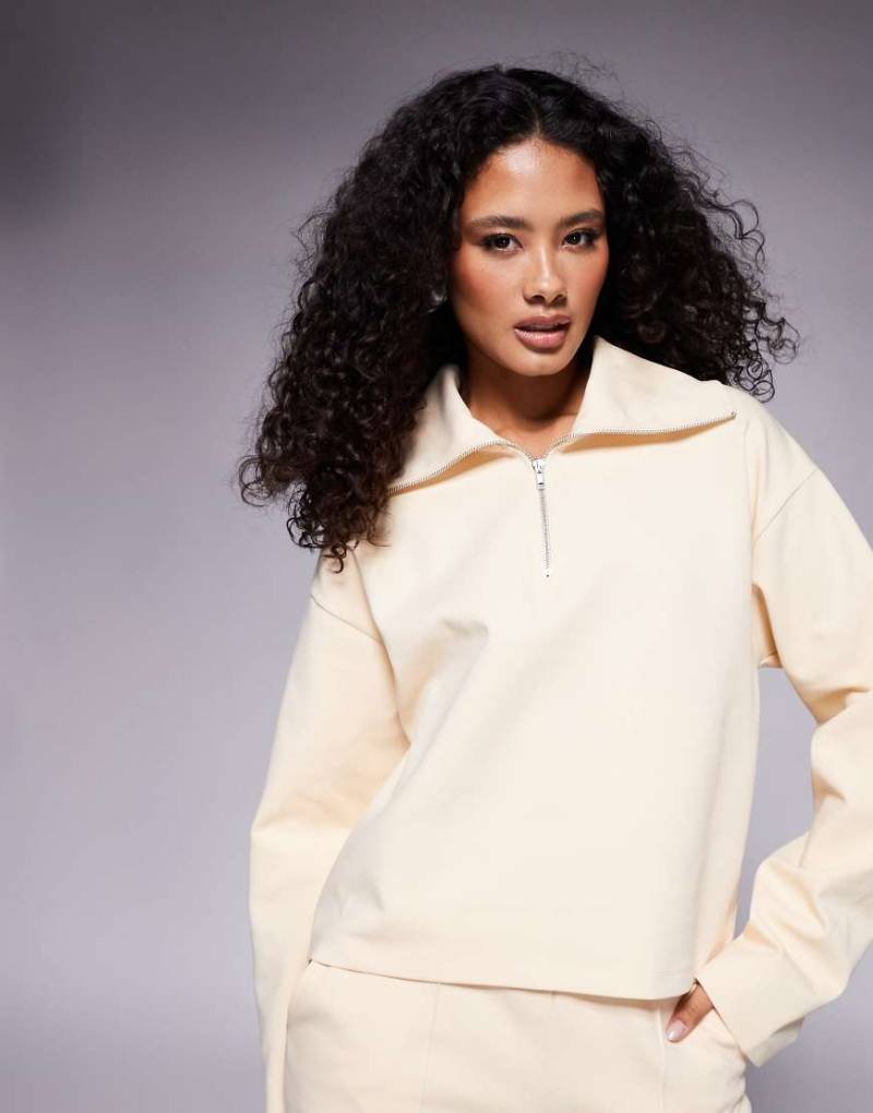 ASOS DESIGN - Interlock-Oberteil in Buttermilchgelb mit kurzem Reißverschluss, Kombiteil von ASOS DESIGN