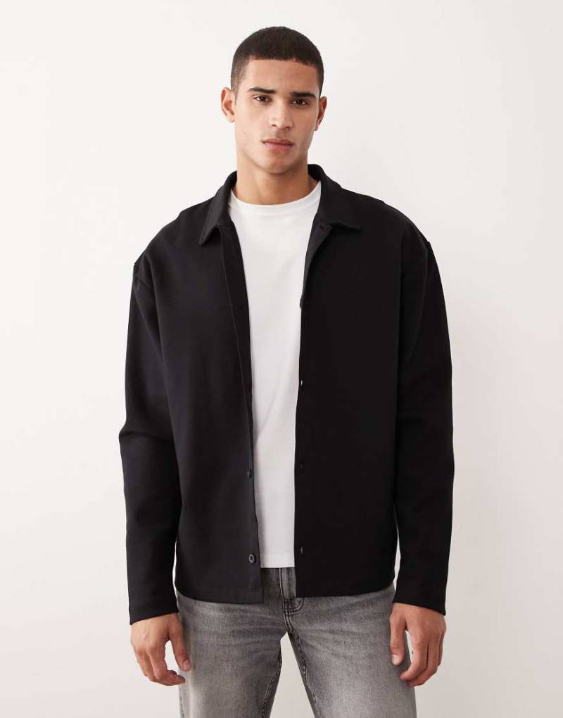 ASOS DESIGN - Jacke aus Jersey in Schwarz mit Knopfleiste und lockerem Schnitt von ASOS DESIGN