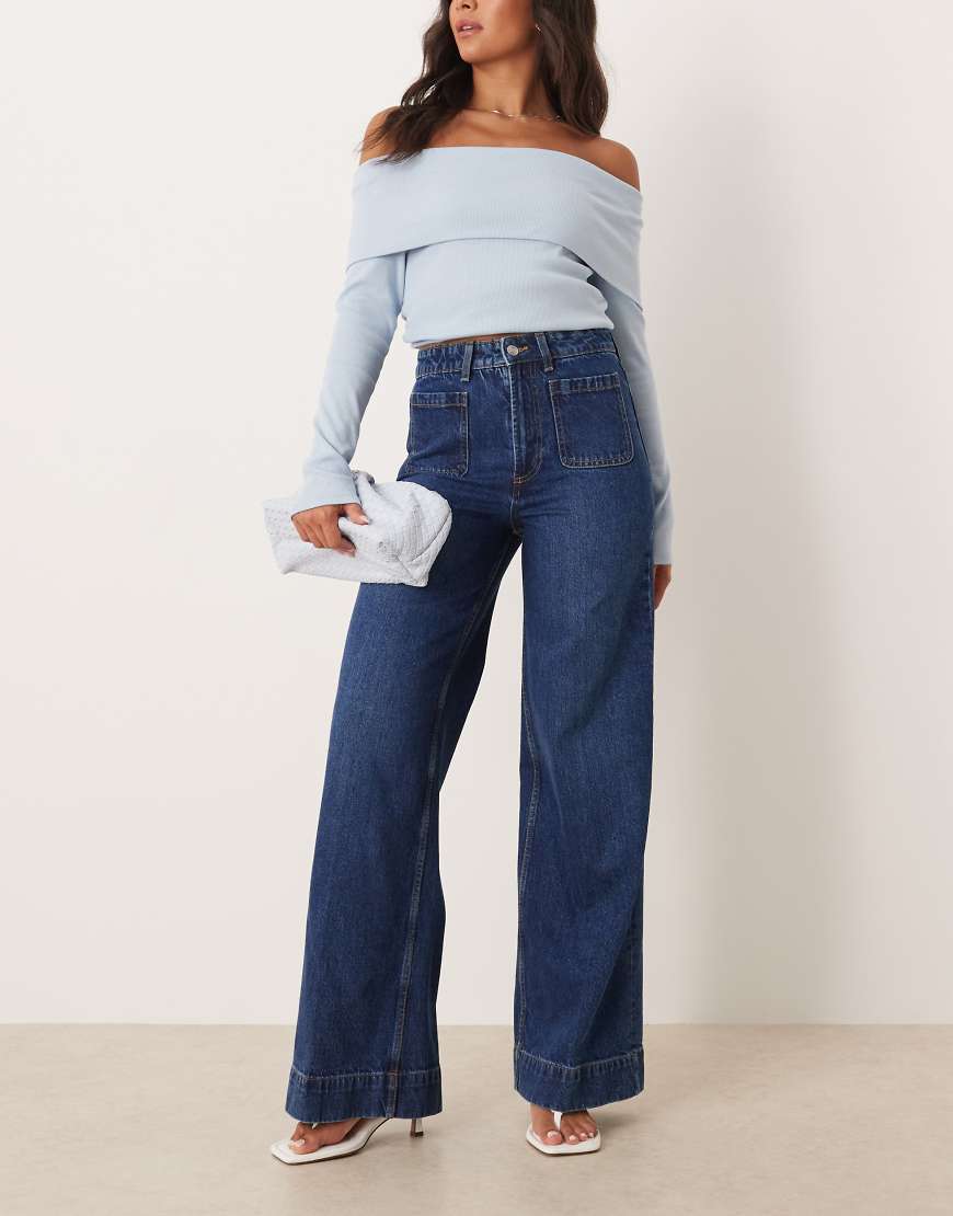 ASOS DESIGN - Jeans in dunkler Waschung mit hohem Bund, weitem Bein und Vordertaschen-Blau von ASOS DESIGN