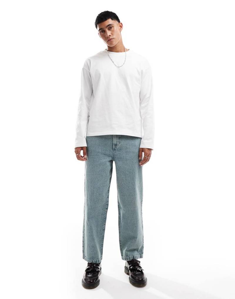 ASOS DESIGN - Jeans in mittlerer Stone-Waschung mit weiter Passform-Blau von ASOS DESIGN