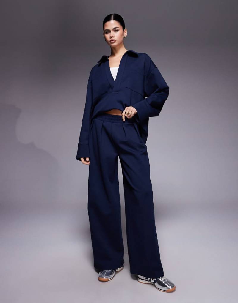 ASOS DESIGN - Jogginghose aus Interlock-Stoff in Marineblau mit weitem Bein, Kombiteil ASOS DESIGN - Jogginghose aus Interlock-Stoff in Marineblau mit weitem Bein, Kombiteil von ASOS DESIGN